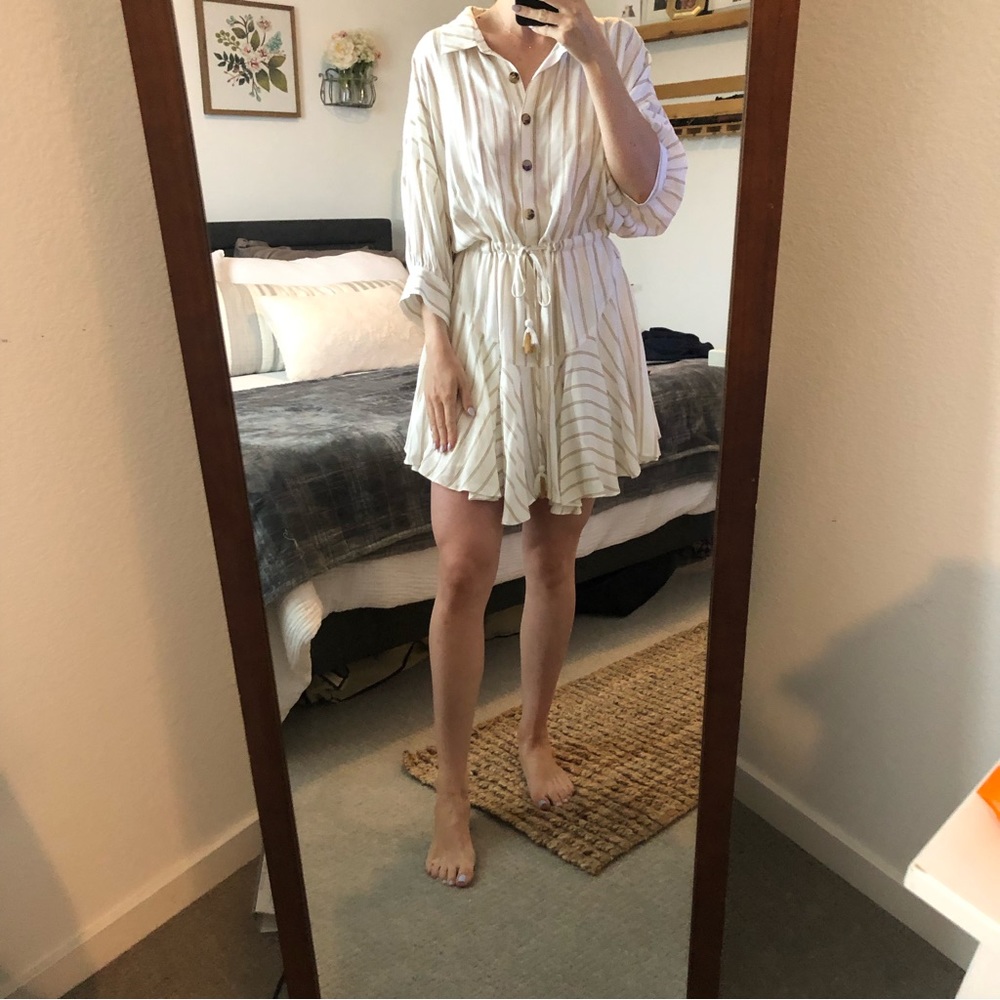 White and tan detailed dress with a cinched waist and collared neck